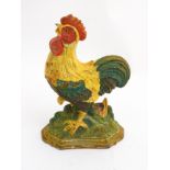 A cast iron doorstop formed as a polychrome painted cockerel.