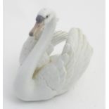 A 20thC Lladro figure of a swan, no. 5231, printed and impressed marks to base. Approx.