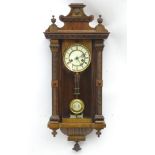 Hamburg Vienna clock: A walnut and stained pine Vienna wall clock having a 30 hour movement and