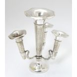 A silver plate epergne / centrepiece with 3 epergne flutes 7 1/4" high CONDITION: