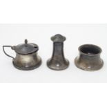 An Art Deco three piece silver cruet comprising salt,