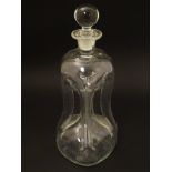 A late 19thC / early 20thC clear glass spirit decanter of pinched cruciform, with stopper, 11” high.