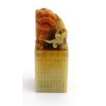A Chinese nephrite? hand seal formed as a Dog of Foo surmounting a cube with characters to sides 3