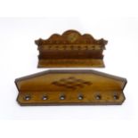 Pipe smoking: An early 20thC oak pipe rack, with provision for nine pipes,