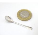 A 19thC white metal miniature spoon, possibly a snuff / cayenne spoon or a dolls house spoon.