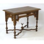 A late 19thC / early 20thC walnut Moorish style table with rectangular moulded top above spindled