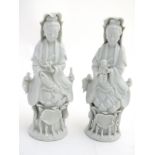 A matched pair of dehua porcelain/blanc de Chine figures,
