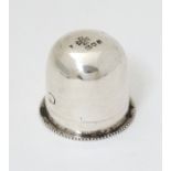 A small silver box with screw base and domed cover, possibly a pyx / wafer box,