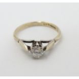A hallmarked silver gilt ring set with white stone solitaire.