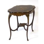 An early 20thC mahogany occasional table with marquetry inlay and decorative banding,