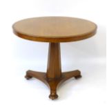 A 19thC mahogany occasional table with a circular tilt table top,
