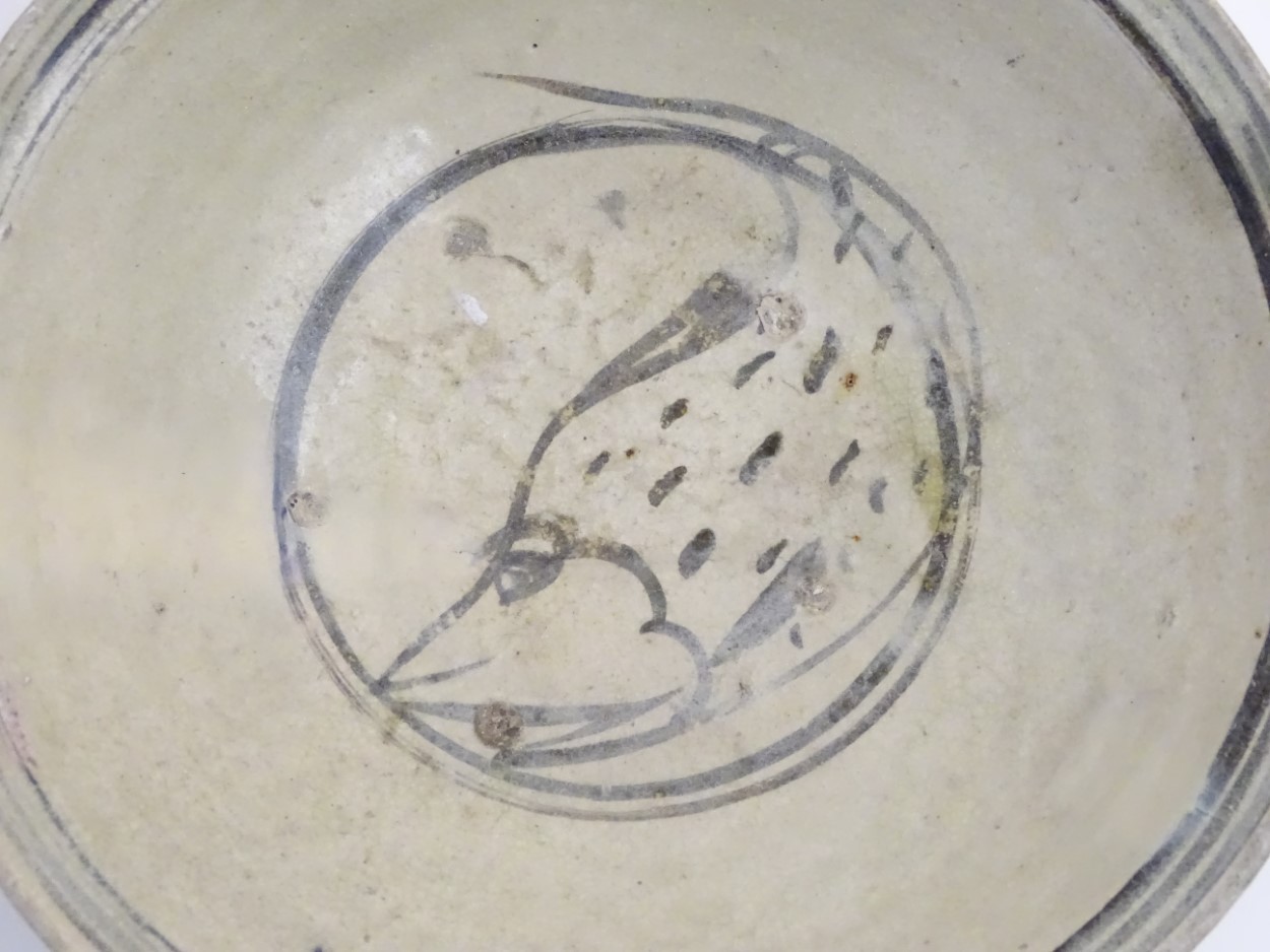 A Chinese Ming Dynasty celadon glazed bowl with hand painted fish decoration to the centre and - Image 5 of 5