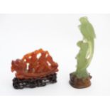 Jadeit / Nephrite : A stone carving depicting two figures on a dragon boat,