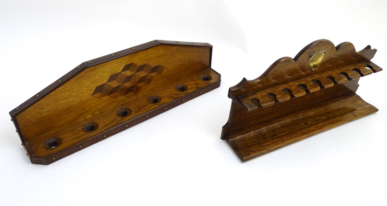 Pipe smoking: An early 20thC oak pipe rack, with provision for nine pipes, - Image 2 of 12