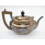 A silver teapot hallmarked Sheffield 1898 maker Atkin Brothers 10 1/2" long x 6 1/2" high (608g)