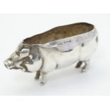 A silver pin cushion base formed as a pig hallmarked Birmingham 1906 maker S Blanckensee & Son Ltd.