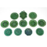 A quantity of Victorian and later majolica cabbage leaf plates in a green glaze,
