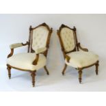 A pair of late 19thC walnut salon chairs with carved cresting rail and button back upholstery,