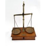 Balance scales: Early-mid 20thC brass and mahogany shop balance scales with drawer opening under