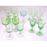 A quantity of pedestal wine glasses, to include some uranium examples.