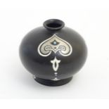 A small black Shelley vase with silver and white Art Nouveau style decoration.