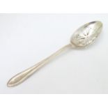 A silver straining spoon with pierced bowl hallmarked Sheffield 1988 maker Roberts & Belks 8 1/4"