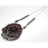 A silver white metal pendant set with various stone cabochon including amethyst spinel,