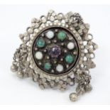 A silver white metal ring, set with various stone cabochon including opal, emerald and ruby.