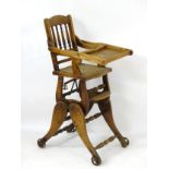 A late 19thC / early 20thC metamorphic childs chair with spindled backrest and adjustable eating