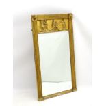 An early 19thC gilt pier mirror with lions mask decoration above fluted top and sides,