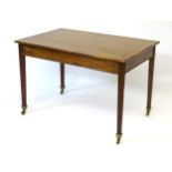 A late 18thC mahogany centre table with rectangular top above tapering squared reeded legs