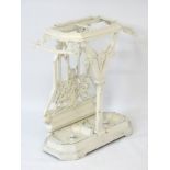 A Victorian white painted cast iron stick stand with Y front frame,