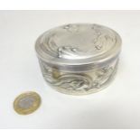 WMF : A bright silver finish embossed lidded pot decorated with scrolling fish decorated 3 1/4"