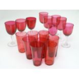A quantity of ruby wine glasses and tumblers.