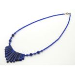A Lapiz Lazuli and blue glass bead necklace of choker form approx 16" long CONDITION: