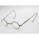 A pair of nickel reading spectacles / glasses of circular design.