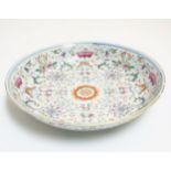 A Chinese famille rose plate, decorated with scrolling lotus flowers, having bat,