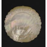 A 19thC carved mother of pearl circular plate / dish with wriggle work decoration.