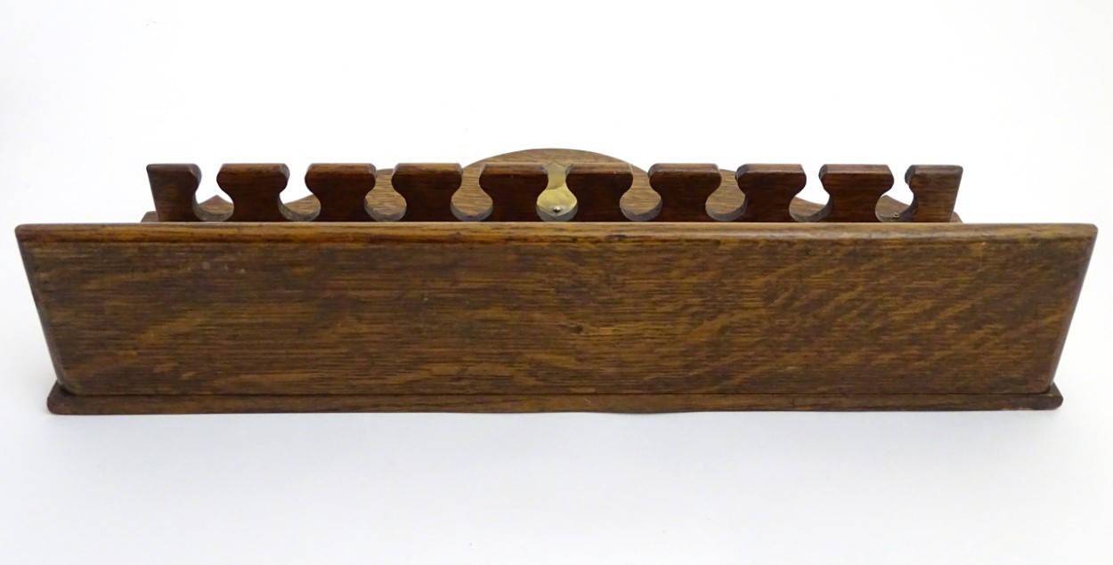 Pipe smoking: An early 20thC oak pipe rack, with provision for nine pipes, - Image 3 of 12