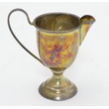 A silver cream jug hallmarked Birmingham 1926 maker Henry Moreton 3 3/4" high (50g)