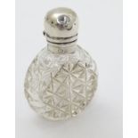 A small cut glass scent / perfume bottle with silver mount hallmarked Birmingham 1907.