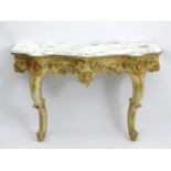 A 19thC marble topped console table with painted and decoratively moulded base,