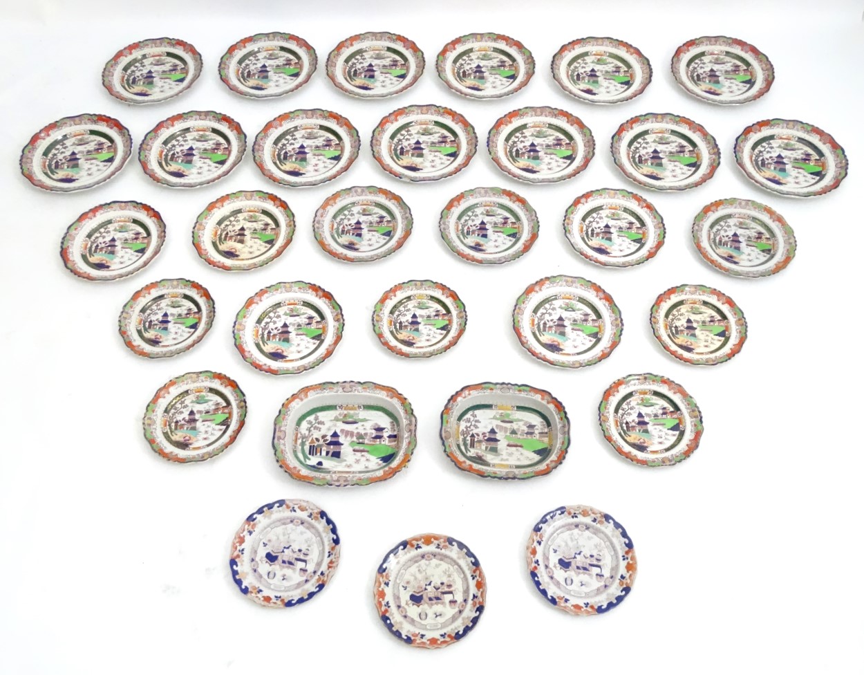 An assorted quantity of iron stone china dinner wares with a chinoiserie scene and clobbered