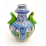 A Persian style garlic-head shaped vase with stylised floral motifs and stylised dancing Indian