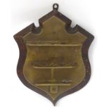 An early 20thC shield-shaped pipe rack,