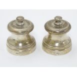 A pair of small salt and pepper mills / grinders. hallmarked London 1988 maker Mappin & Webb.