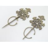 A pair of Celtic style white metal cloak clasps, indistinctly marked verso maker G.