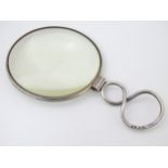 A magnifying glass with silver handle hallmarked London 1848 maker JWH.