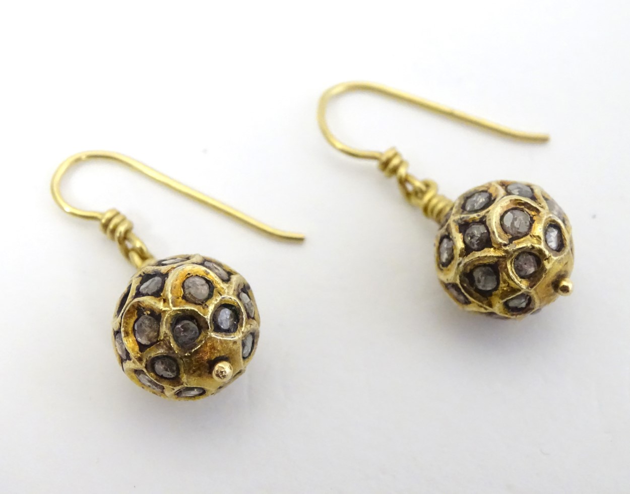 A pair of Art Deco 9ct gold and gilt drop earrings of spherical form set with a profusion of
