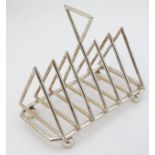 A late 20thC silver plate toast rack of triangular form 7" long CONDITION: Please